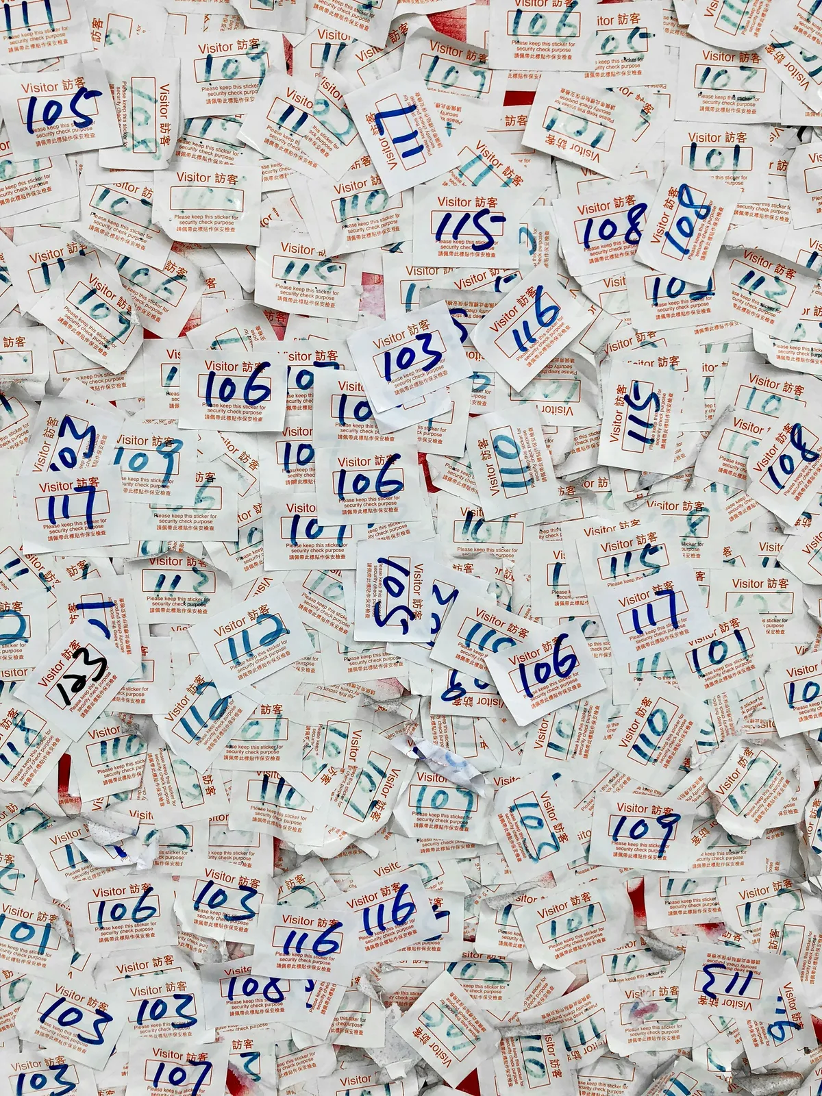 A large pile of survey forms